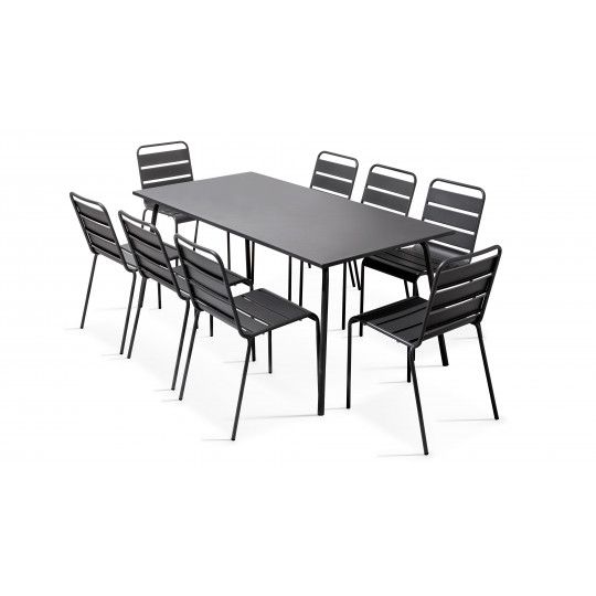 Table grise rectangulaire intérieure et 8 chaises