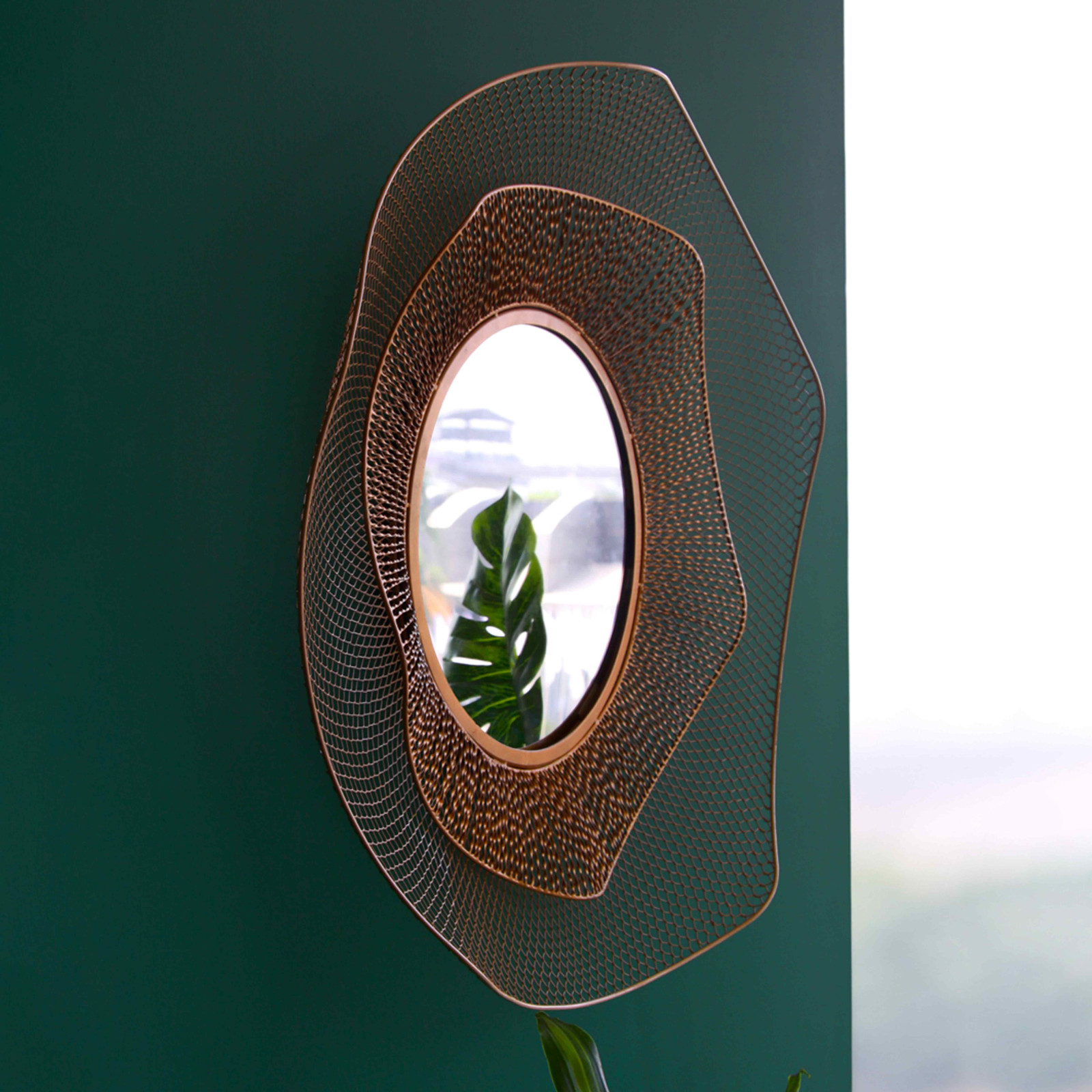 Miroir en métal forme organique