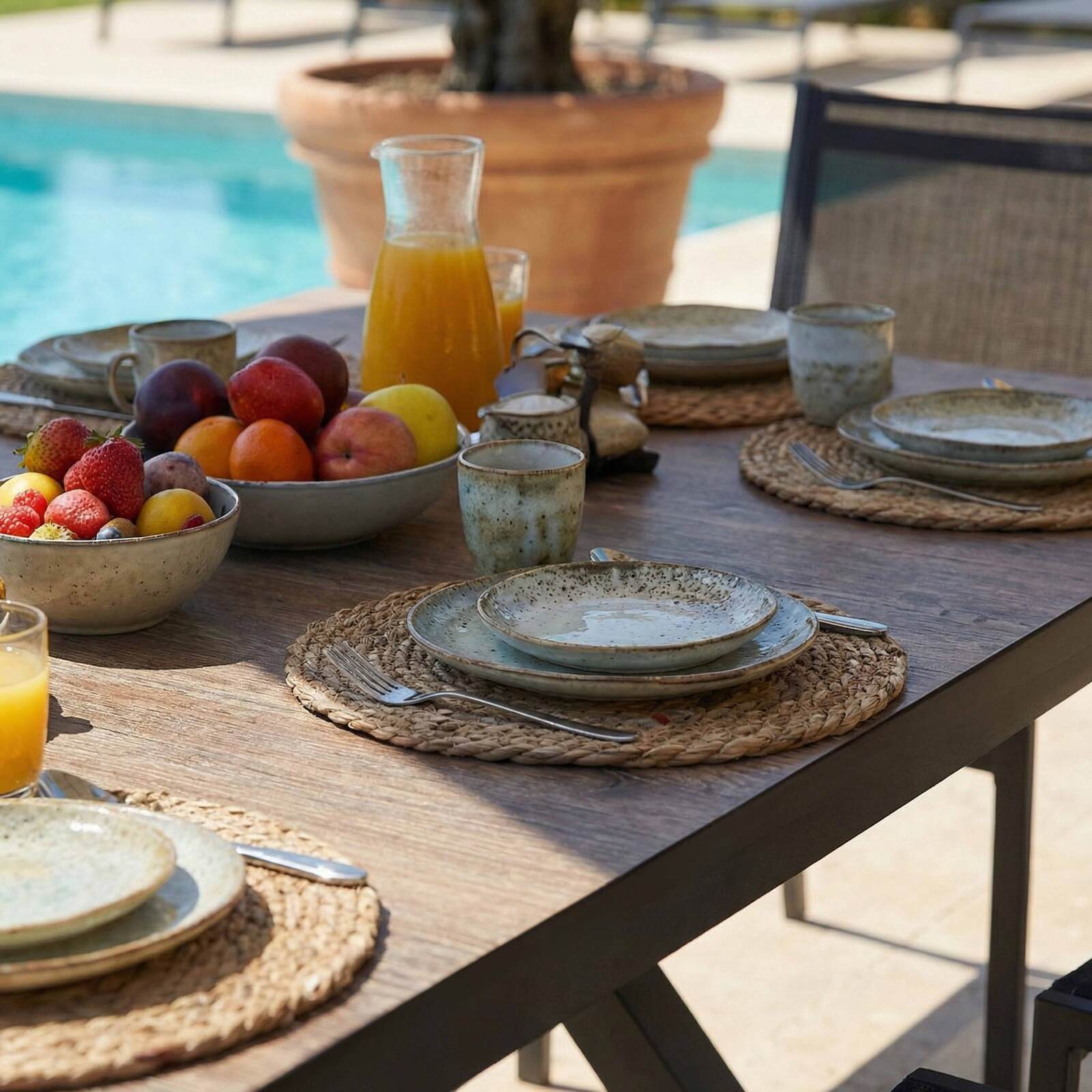 Table de jardin en aluminium et céramique effet bois 201x100 cm et 10 chaises empilables en textilène